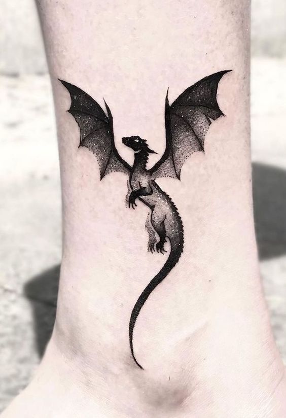 Black dragon ankle tattoo