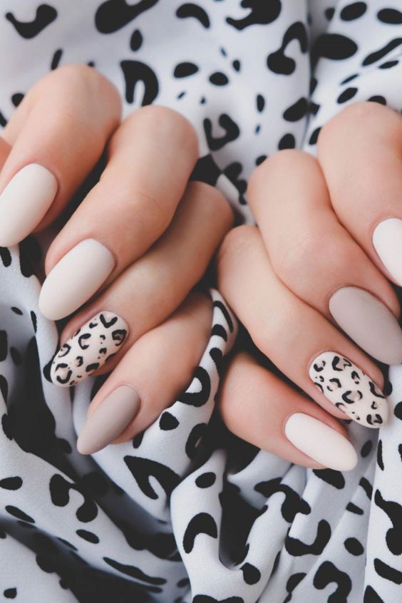 cream manicure with Neutral-toned animal prints