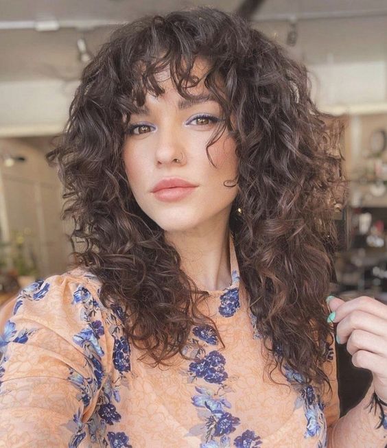 Curly Layers with Short Bangs