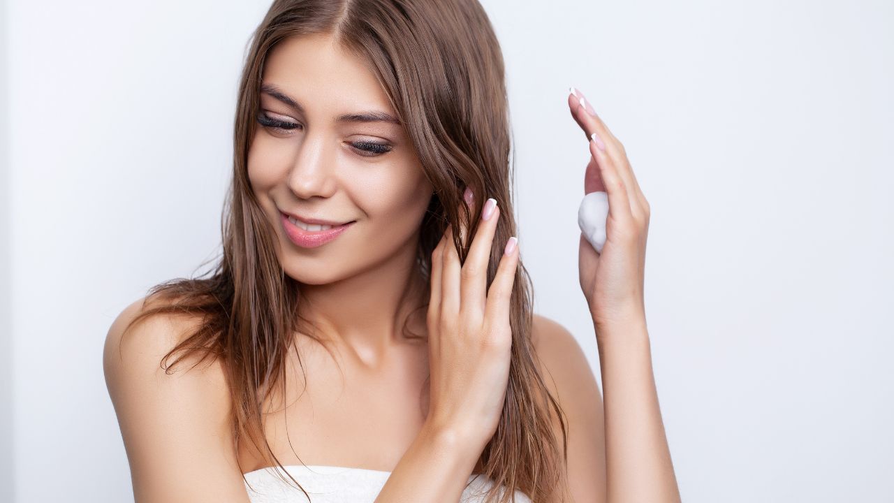 woman taking care of her hair